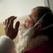 Ann Arbor Santa Claus Danny Maier adjusts his beard at his home on Sunday. Daniel Brenner I AnnArbor.com